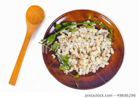 Fresh Red ant eggs are larvae of ants in wood dish Fresh Red ant eggs are larvae of ants in wood dish 49686296