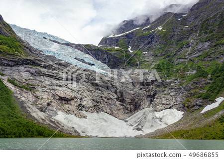 Briksdalsbreen glacier with melting blue ice Briksdalsbreen glacier with melting blue ice 49686855