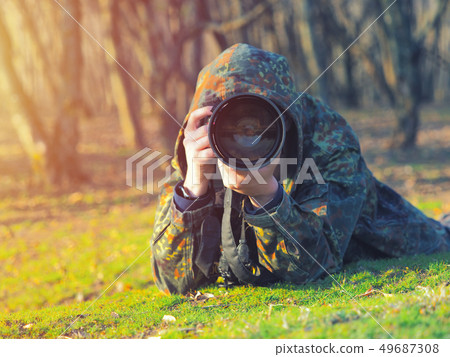 Wildlife, nature man photographer in camouflage Wildlife, nature man photographer in camouflage 49687308