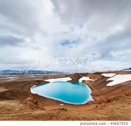 Volcanic lake with turquoise water in Iceland Volcanic lake with turquoise water in Iceland 49687858
