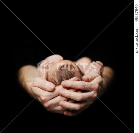 Parenthood concept. Newborn baby on father's hand Parenthood concept. Newborn baby on father's hand 49687940