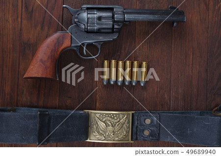 Old revolver with cartridges  49689940