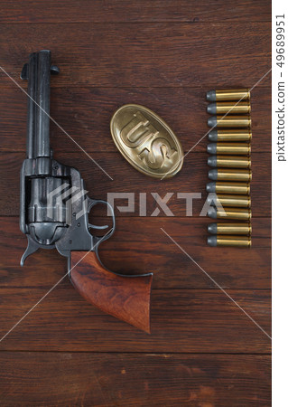 Old revolver with cartridges  49689951