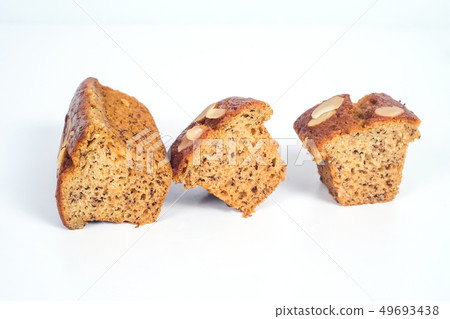 Homemade banana cake with almond and nuts on white 49693438