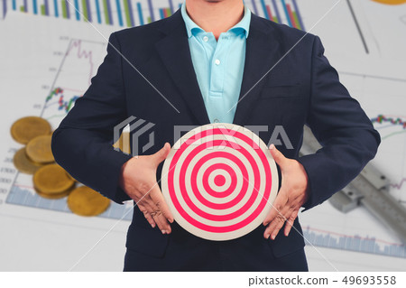Business Man holding dart board ,Business target 49693558