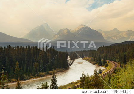 Mountain river and railway 49694394