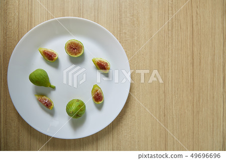 Fresh organic fig on white plate 49696696