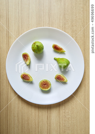 Fresh organic fig on white plate 49696699