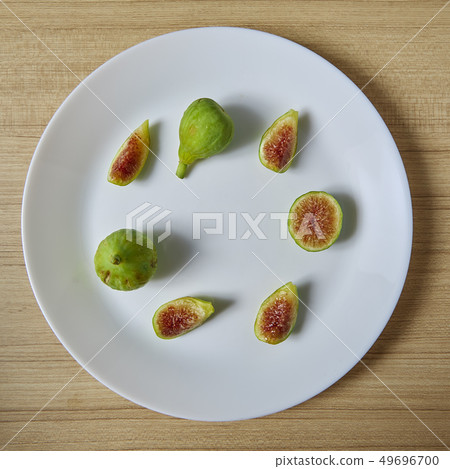 Fresh organic fig on white plate 49696700