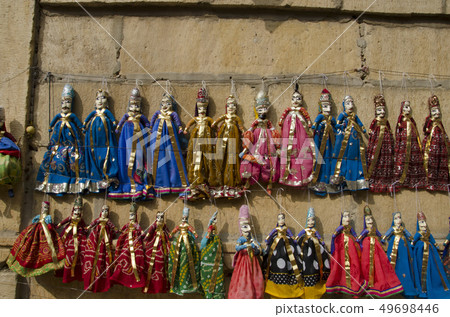 Colorful Puppets displayed on the wall, Jaisalmer Colorful Puppets displayed on the wall, Jaisalmer 49698446