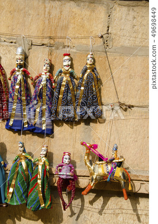 Colorful Puppets displayed on the wall, Jaisalmer 49698449