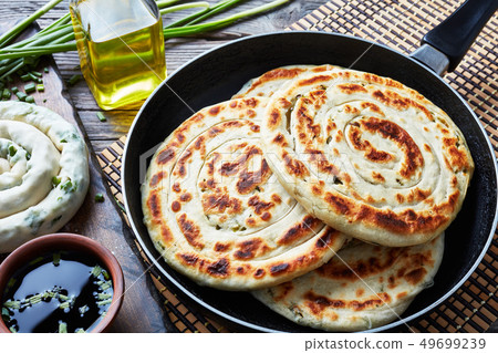 close-up of hot Chinese green onion Pancakes close-up of hot Chinese green onion Pancakes 49699239