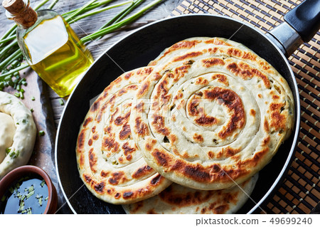 close-up of hot Chinese green onion Pancakes close-up of hot Chinese green onion Pancakes 49699240