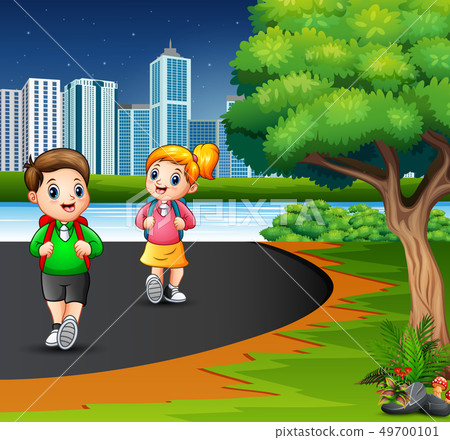 Happy school children are walking on the road 49700101
