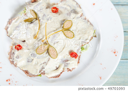 Plate of vitello tonato - veal with tuna sause and 49701093