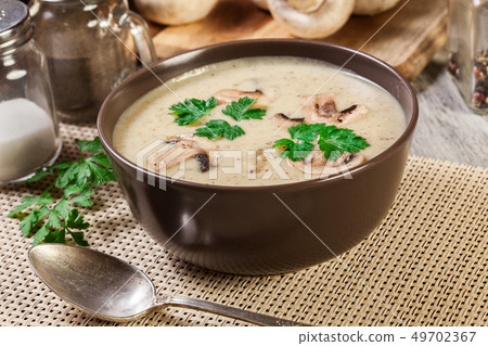 Mushroom cream soup with herbs and spices Mushroom cream soup with herbs and spices 49702367