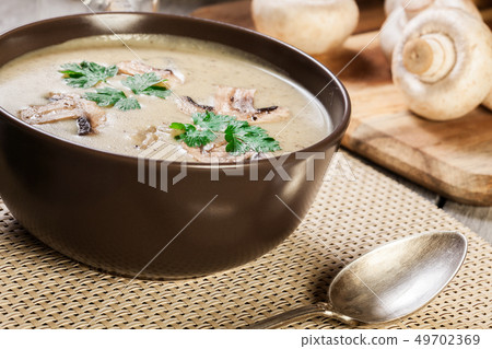 Mushroom cream soup with herbs and spices Mushroom cream soup with herbs and spices 49702369