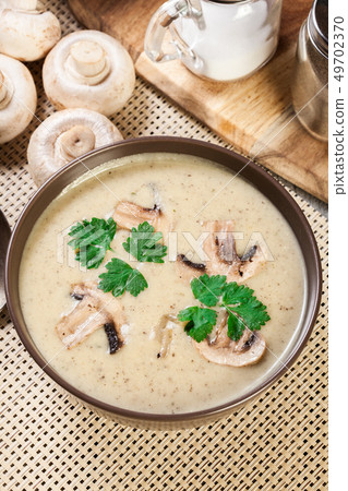 Mushroom cream soup with herbs and spices Mushroom cream soup with herbs and spices 49702370