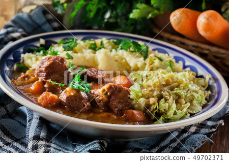 Traditional irish stew served with potatoes and Traditional irish stew served with potatoes and 49702371