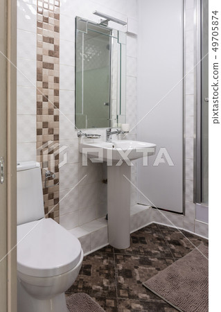 Interior of the combined toilet and bathroom in a Interior of the combined toilet and bathroom in a 49705874