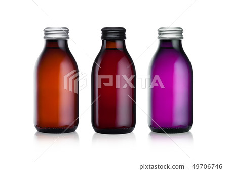 Glass bottles of botanical energy drink on white Glass bottles of botanical energy drink on white 49706746