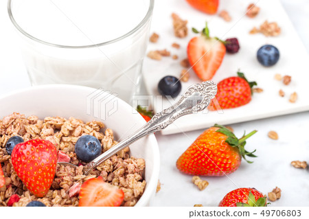 Bowl of healthy cereal granola with strawberries 49706803