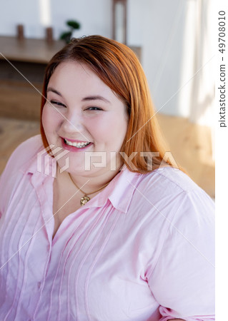 Portrait of a happy cheerful young woman 49708010