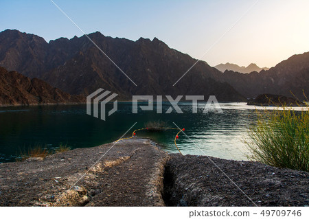 Sunset at Hatta Dam Lake in Dubai emirate of UAE Sunset at Hatta Dam Lake in Dubai emirate of UAE 49709746