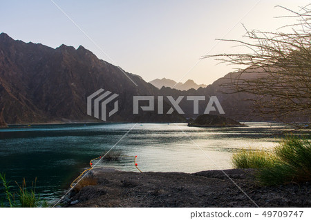 Sunset at Hatta Dam Lake in Dubai emirate of UAE 49709747