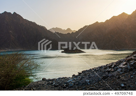 Sunset at Hatta Dam Lake in Dubai emirate of UAE 49709748