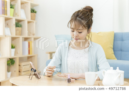 Young Woman Nail Video Call on Smartphone Young Woman Nail Video Call on Smartphone 49712786