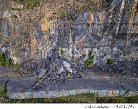 Slate mine with rockfall, top view of the wall Slate mine with rockfall, top view of the wall 49713748