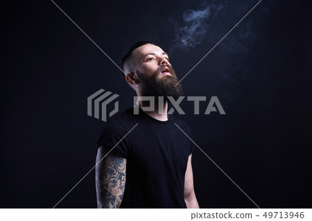 handsome Brutal bearded man in Smoke 49713946