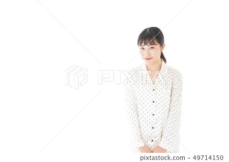 Young woman wearing pajamas 49714150
