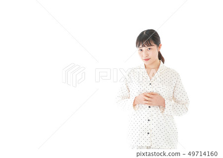 Young woman wearing pajamas Young woman wearing pajamas 49714160