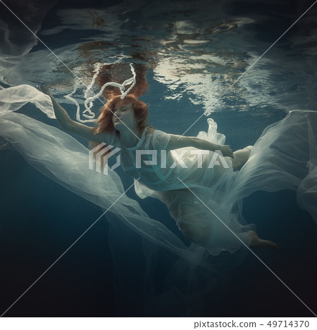 Girl in a white dress under water Girl in a white dress under water 49714370