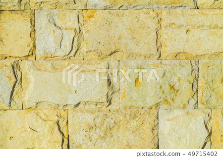 Stone wall pattern. Big concrete bricks outside. 49715402