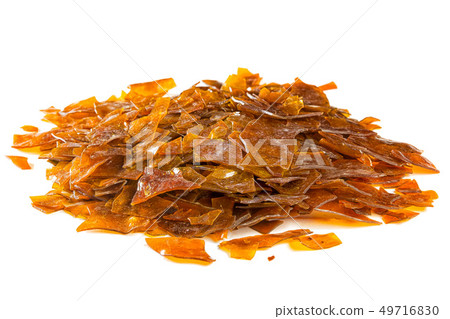 Natural shellac in flakes, which is used as food glaze and wood finish Natural shellac in flakes, which is used as food glaze and wood finish 49716830