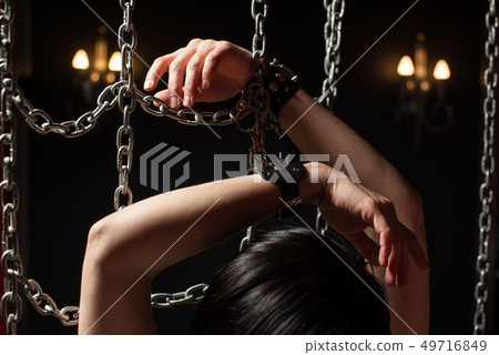 woman in chains Stock Photo