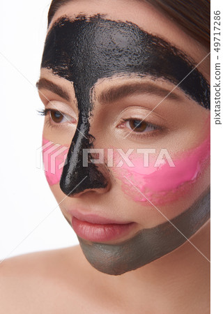 Face of beautiful lady having three nourishing masks on it 49717286