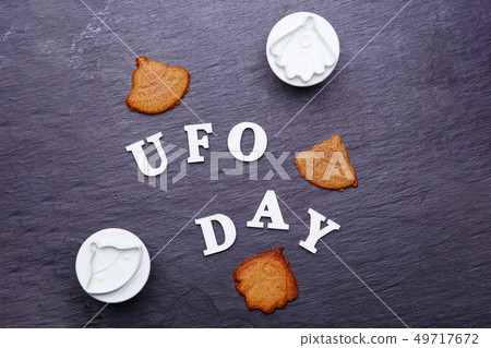 Text UFO day and cookies in the form of a flying saucer and an alien Text UFO day and cookies in the form of a flying saucer and an alien 49717672