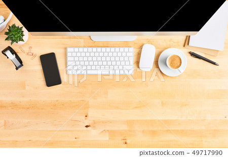 Top view of large desktop computer on wooden table Top view of large desktop computer on wooden table 49717990