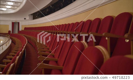 The interior of the theater arts. The auditorium with seats and balcony. Soft focus. Seats in the The interior of the theater arts. The auditorium with seats and balcony. Soft focus. Seats in the 49718223