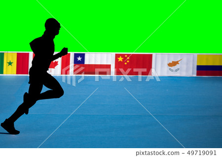 Fast marathon runner silhouette with green background and flags 49719091