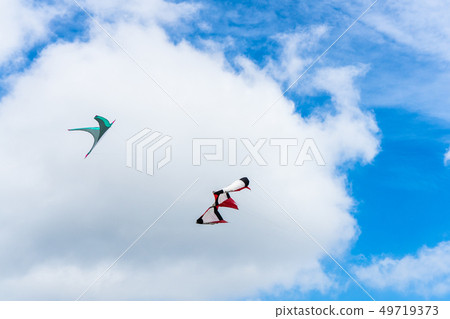 Kites flying in the sky among the clouds.Kite Kites flying in the sky among the clouds.Kite 49719373