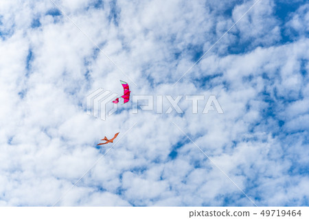 Kites flying in the sky among the clouds.Kite Kites flying in the sky among the clouds.Kite 49719464
