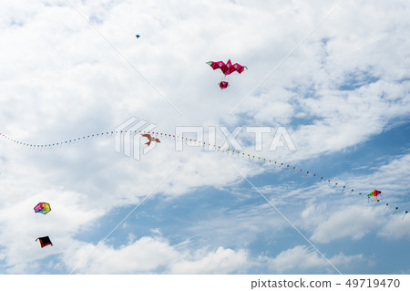 Kites flying in the sky among the clouds.Kite Kites flying in the sky among the clouds.Kite 49719470