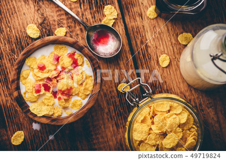 Breakfast with corn flakes, milk and berry syrup Breakfast with corn flakes, milk and berry syrup 49719824