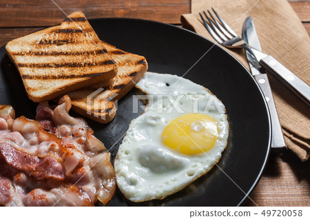 Fried egg and bacon Fried egg and bacon 49720058
