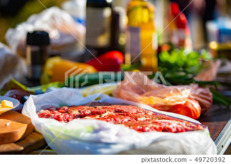 Raw meet marinated with vegetables ready to cook 49720392
